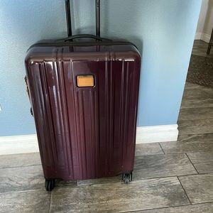 TUMI SHORT TRIP CHECK LUGGAGE.